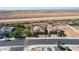 Street-level aerial view of the property showcasing desert landscaping, tile roofs, and neighborhood layout at 26774 W Firehawk Dr, Buckeye, AZ 85396