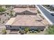 Birds-eye view of the property highlighting the tile roof, patio, landscaping, and outdoor seating at 26774 W Firehawk Dr, Buckeye, AZ 85396