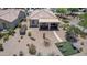 Aerial view of the property featuring a covered patio, desert landscaping, and outdoor seating areas at 26774 W Firehawk Dr, Buckeye, AZ 85396