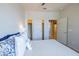 Relaxing bedroom featuring a comfortable bed, ceiling fan, and closet space at 26774 W Firehawk Dr, Buckeye, AZ 85396