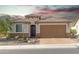 Charming single-story home with desert landscaping and a tile roof, perfect for curb appeal at 26774 W Firehawk Dr, Buckeye, AZ 85396