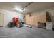 Organized garage with ample storage cabinets and shelving at 26774 W Firehawk Dr, Buckeye, AZ 85396