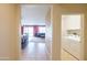 Open floor plan showcasing a hallway leading to living spaces, including a laundry room at 26774 W Firehawk Dr, Buckeye, AZ 85396