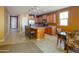 Spacious kitchen with stainless steel appliances, an island, and tile flooring, ideal for cooking at 26774 W Firehawk Dr, Buckeye, AZ 85396