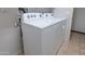 Laundry room showcasing a white washer and dryer set at 26774 W Firehawk Dr, Buckeye, AZ 85396