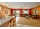Spacious living area with open kitchen, dining, and living room featuring outdoor access at 26774 W Firehawk Dr, Buckeye, AZ 85396
