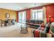 Open living space combining a dining area and living room with access to the outdoor patio at 26774 W Firehawk Dr, Buckeye, AZ 85396