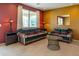 Comfortable living room with sofas, side tables, and a glass coffee table at 26774 W Firehawk Dr, Buckeye, AZ 85396