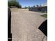 Low-maintenance backyard features rock landscaping and block fencing at 2831 W Montecito Ave, Phoenix, AZ 85017