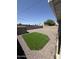 The backyard offers a patch of artificial turf with gravel and a shed for storage solutions at 2831 W Montecito Ave, Phoenix, AZ 85017