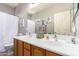 A well-lit bathroom boasting a double vanity, ample counter space, and a clean, modern design at 3059 E Parkview Dr, Gilbert, AZ 85295