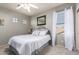 Comfortable bedroom featuring soft gray walls and a window with sheer white curtains at 3059 E Parkview Dr, Gilbert, AZ 85295