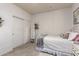Bright bedroom featuring white walls, plush carpet, and sliding closet doors at 3059 E Parkview Dr, Gilbert, AZ 85295