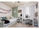 Charming bedroom with a daybed, whimsical decor, and plenty of natural light for a cozy and inviting space at 3059 E Parkview Dr, Gilbert, AZ 85295