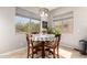 Cozy breakfast nook featuring a round table, four chairs, and bright natural light at 3059 E Parkview Dr, Gilbert, AZ 85295