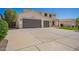 Two-story home featuring a wide driveway leading to a three-car garage, combining functionality with a classic design at 3059 E Parkview Dr, Gilbert, AZ 85295