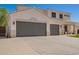 Two-story home featuring a wide driveway leading to a three-car garage, combining functionality with a classic design at 3059 E Parkview Dr, Gilbert, AZ 85295