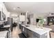 Gourmet kitchen featuring a large island, stainless appliances, and open floor plan at 3059 E Parkview Dr, Gilbert, AZ 85295