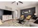 Inviting living room with stylish decor, including two armchairs and a decorative rug at 3059 E Parkview Dr, Gilbert, AZ 85295