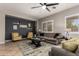 Comfortable living room with tile floors, ceiling fan, neutral palette, and a stylish area rug at 3059 E Parkview Dr, Gilbert, AZ 85295