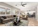 Spacious living room with large windows, ceiling fan, and open floor plan at 3059 E Parkview Dr, Gilbert, AZ 85295
