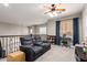 Cozy loft with plush seating, a ceiling fan, and natural light at 3059 E Parkview Dr, Gilbert, AZ 85295