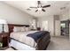 This main bedroom is spacious and bright, featuring a large wooden bed and access to an ensuite bathroom at 3059 E Parkview Dr, Gilbert, AZ 85295