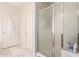 Clean, bright bathroom features an enclosed shower and a marble floor for a modern and stylish aesthetic at 3059 E Parkview Dr, Gilbert, AZ 85295