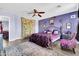 Spacious bedroom featuring purple walls and stylish decor at 31269 N Cavalier Dr, San Tan Valley, AZ 85143