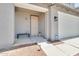 Covered porch and entryway featuring a bench and security system at 31269 N Cavalier Dr, San Tan Valley, AZ 85143