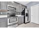 Spacious kitchen featuring stainless steel appliances and ample gray cabinetry at 31269 N Cavalier Dr, San Tan Valley, AZ 85143