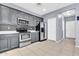 Spacious kitchen featuring stainless steel appliances and gray cabinetry at 31269 N Cavalier Dr, San Tan Valley, AZ 85143