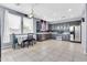 Updated kitchen with stainless steel appliances, gray cabinets, and tile flooring at 31269 N Cavalier Dr, San Tan Valley, AZ 85143