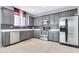 Updated kitchen featuring stainless steel appliances and sleek gray cabinetry at 31269 N Cavalier Dr, San Tan Valley, AZ 85143