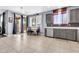 Large eat-in kitchen with grey cabinets, dining table, and tile floors at 31269 N Cavalier Dr, San Tan Valley, AZ 85143