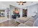 Comfortable living room with a large sectional couch and ample natural light at 31269 N Cavalier Dr, San Tan Valley, AZ 85143