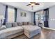 Comfortable living room with a large sectional couch and ample natural light at 31269 N Cavalier Dr, San Tan Valley, AZ 85143