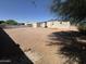 A desert landscape backyard with a fence at 318 N Pinal Dr, Apache Junction, AZ 85120