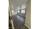 Bedroom with wood floors, AC unit and a back door at 318 N Pinal Dr, Apache Junction, AZ 85120