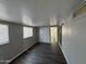 This bedroom has hardwood floors, neutral walls, and a closet at 318 N Pinal Dr, Apache Junction, AZ 85120