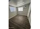 Bedroom featuring wood floors, an AC unit, and a bright window at 318 N Pinal Dr, Apache Junction, AZ 85120