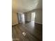Living room with wood floors, sliding glass door and access to other rooms at 318 N Pinal Dr, Apache Junction, AZ 85120