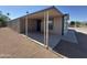 A home with a covered patio and lattice work at 318 N Pinal Dr, Apache Junction, AZ 85120