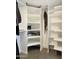 Organized closet with white shelves and ample storage space for shoes and clothing at 4050 E Cactus Rd # 107, Phoenix, AZ 85032