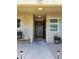 Charming front entrance with a rustic wood door and lovely landscaping, inviting guests into a cozy home at 4050 E Cactus Rd # 107, Phoenix, AZ 85032