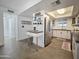 Stylish kitchen with stainless steel refrigerator, modern countertops, and a bright skylight, creating an inviting atmosphere at 4050 E Cactus Rd # 107, Phoenix, AZ 85032
