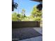 Cozy patio area surrounded by lush landscaping and greenery at 4050 E Cactus Rd # 107, Phoenix, AZ 85032