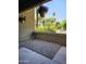 Charming patio area with gravel, potted plants, and views of the surrounding landscape at 4050 E Cactus Rd # 107, Phoenix, AZ 85032