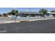 Charming single story home with a painted gray exterior and a block wall at 4502 N 50Th Ave, Phoenix, AZ 85031