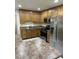 Traditional kitchen with wooden cabinets, stainless steel appliances, and laminate counters at 4502 N 50Th Ave, Phoenix, AZ 85031